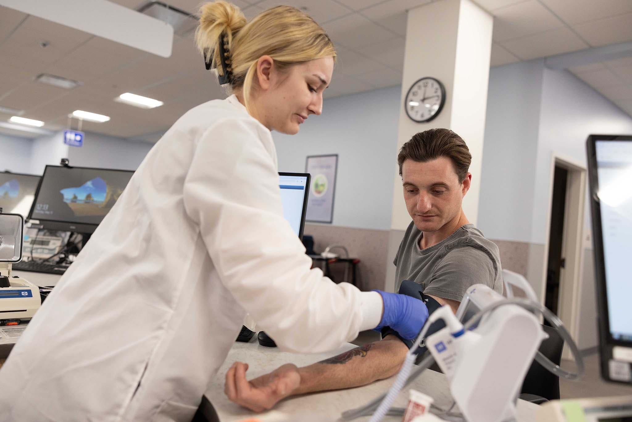 Donor getting blood pressure taken from nurse